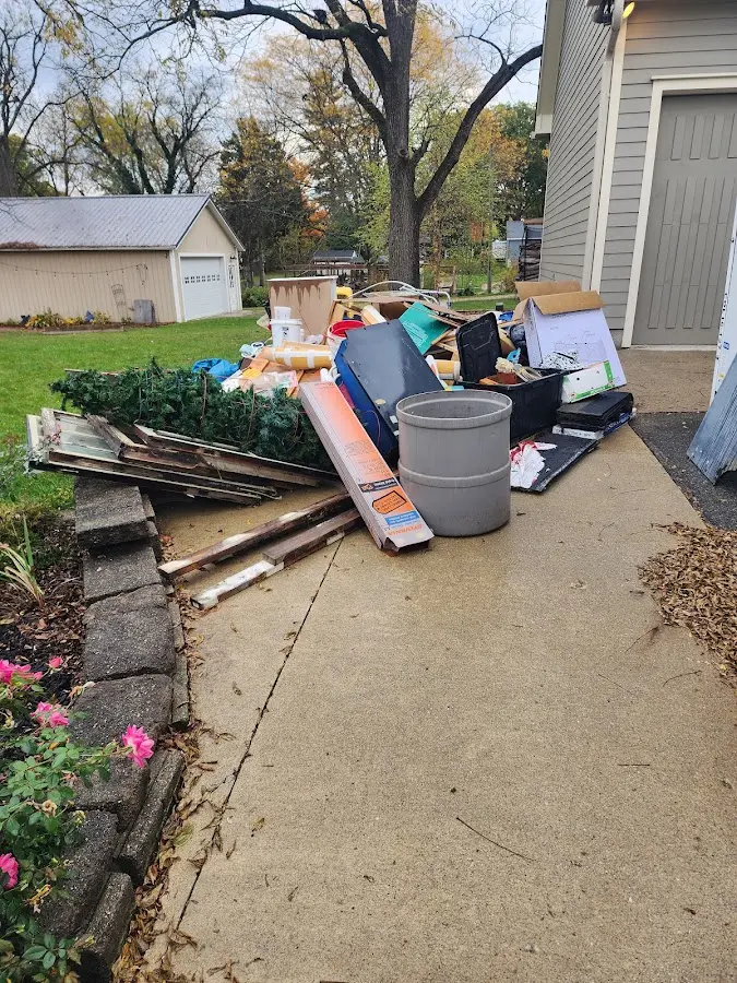 Dumpster being loaded with debris for 3 Yard Dumpster Rental in Palm City